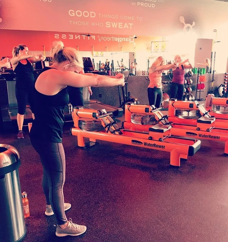 At Orange Theory Rock Hill, members finish their post-workout cool down with stretches