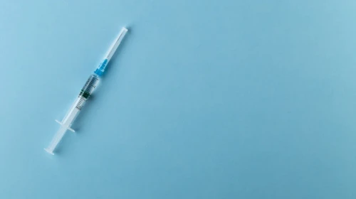 Regenerative Medicine | Stock Photo of Medical Needle on Blue Background