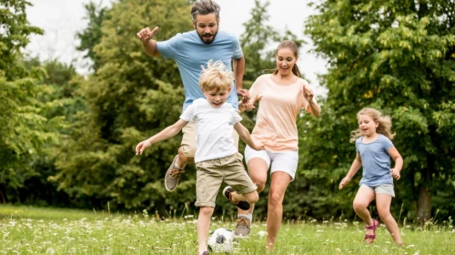 Family Running and Playing Soccer