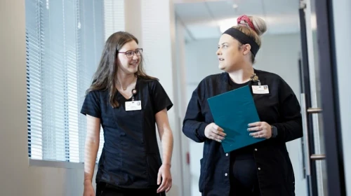 medical staff talking in hallway