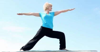 Exercising in the Park | Woman practicing yoga outside