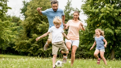 Family Running and Playing Soccer