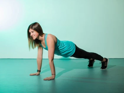 Female doing a plank getting a stronger core and better posture