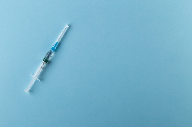 Regenerative Medicine | Stock Photo of Medical Needle on Blue Background