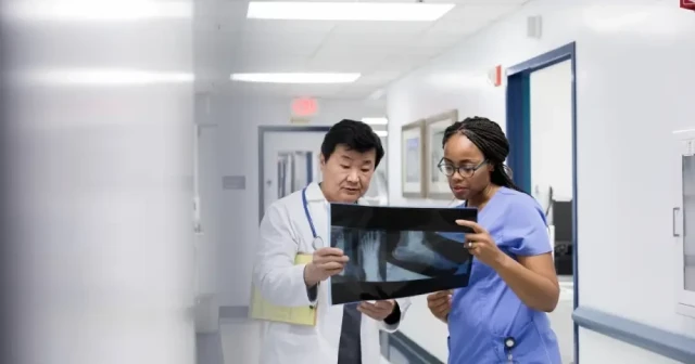 physicians looking at x-ray together