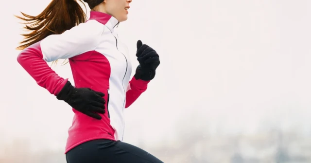 Woman running outside in cold weather