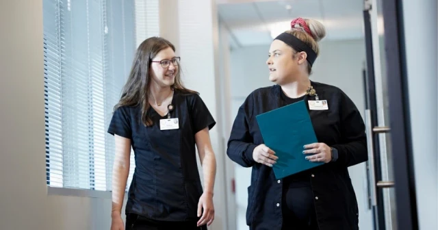 medical staff talking in hallway