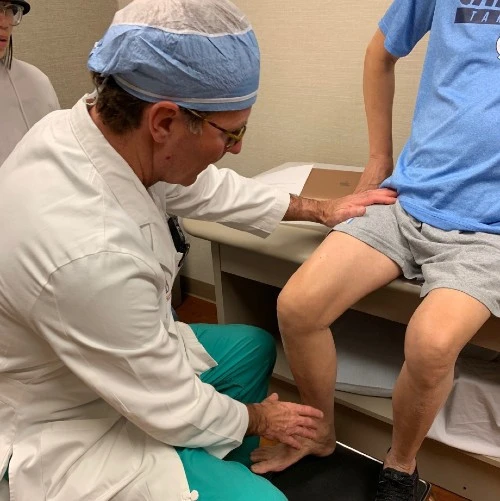 Hip and Knee surgeon J. Bohannon Mason examines Joshua