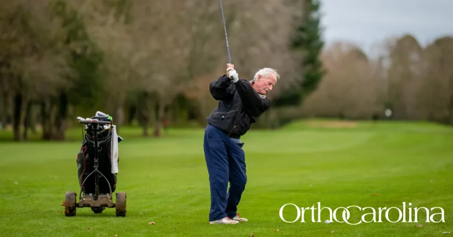 image of older man playing golf