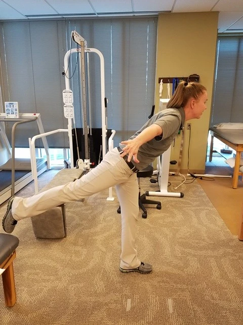 Single leg standing with opposite leg swings