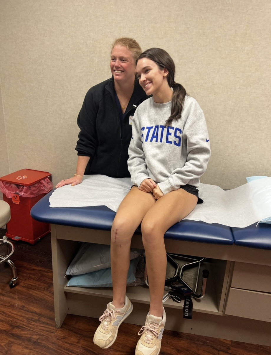 Smiling Athlete Receiving Physical Therapy From PA