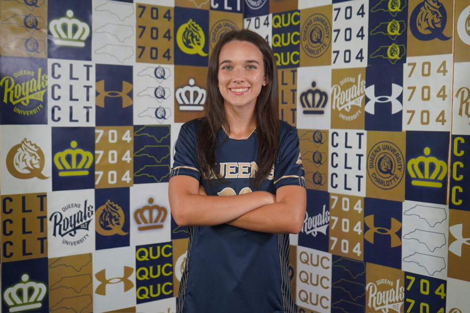 Smiling Female Athlete in Soccer Jersey
